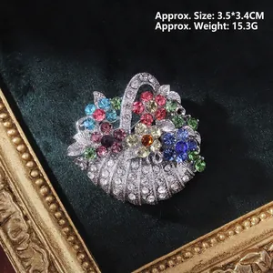 Detailed macro of vintage baroque flower basket brooch with colorful rhinestones 3.5cm