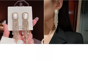 Detail of luxury fringe earrings with s925 silver needle and dangling crystal tassels
