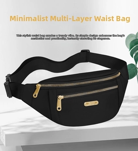Detail view of black nylon waist bag with three golden zippers and adjustable strap