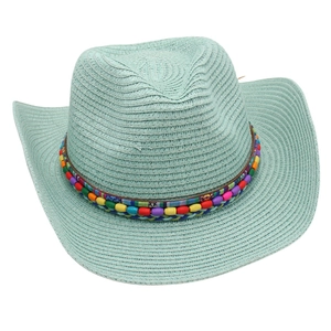 Detailed close-up of light blue straw cowboy hat featuring colorful ethnic beaded band decoration
