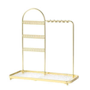 Golden metal jewelry organizer with three-tier earring panel and marble glass base