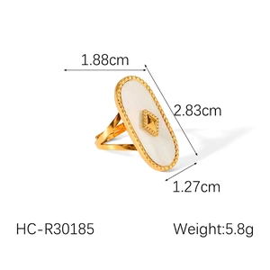 Detail view of 18k gold plated ring showing geometric white shell inlay and measurements