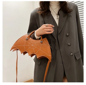 Brown PU leather gothic bat wing bag with white spiderweb stitching and crossbody strap