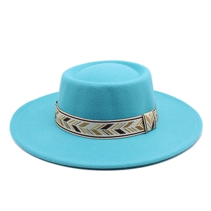 Detail of the chevron weave band on the wide brim blue wool felt boater hat