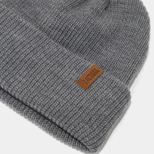 Thick grey ribbed knit beanie with leather letter patch for winter outdoor warmth
