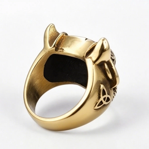 Golden Viking wolf ring with bull horn design and Celtic knot patterns on white background
