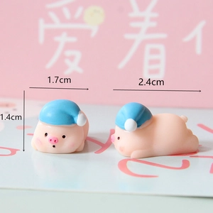 Detailed view of cute miniature pink resin pig figurines showing size measurements