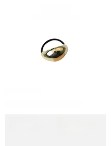 Detailed view of golden alloy geometric charm hair tie with sizing and weight information