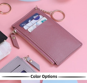 Close-up of pebble-textured leather card holder with multiple slots and metal zipper