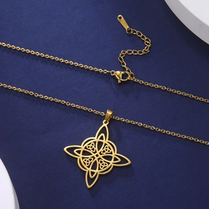 Detail of gold Celtic witch knot pendant on stainless steel chain over blue background
