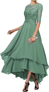 Detail of sage green evening dress showing intricate lace embroidery and beaded floral patterns