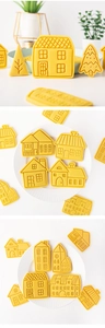 Détail d'un ensemble de moules à biscuits jaunes en forme de maison et de sapin