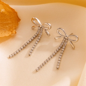 Silver bow earrings with tassel heart charms and sparkling cubic zirconia stones