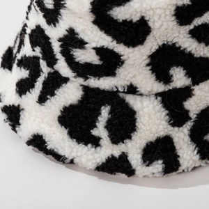 Winter black and white leopard print faux fur bucket hat with thick plush texture for warmth