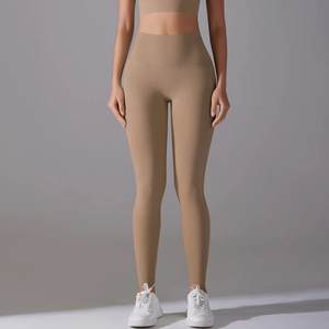 Detail of high-waisted seamless camel yoga pants showing high-stretch athletic fabric texture