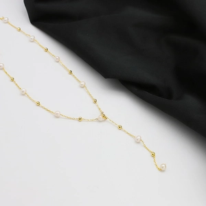 Y-shaped necklace featuring natural freshwater pearls and 18k gold plated beads on a chain