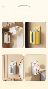 Detail of wall-mounted bear tissue box in white and yellow colors for versatile storage