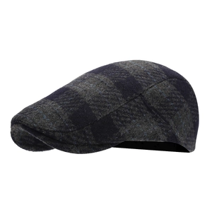 Classic blue plaid tweed flat cap in vintage British style for autumn and winter