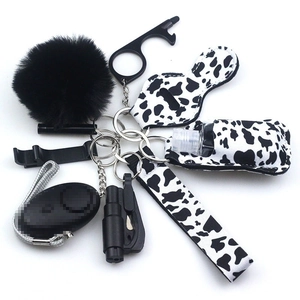 Neoprene personal safety alarm keychain set with cow print lipstick holder and wristlet
