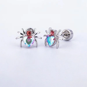 Macro detail of spider stud earring with heart-shaped crystal and screw back design