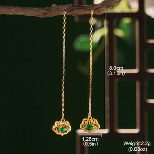 Detailed view of Chinese style long chain earrings with green jade and golden clouds