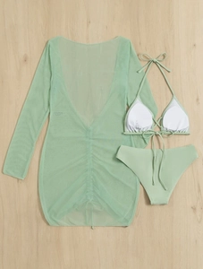 Flat lay of mint green three-piece bikini set with sheer mesh long sleeve cover-up dress