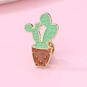 Creative cactus enamel brooch pin with green plant and brown pot design on pink background