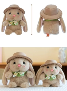 Detail of plush bunny wearing a beige hat and green floral scarf in two sizes