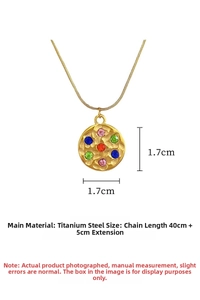 Detail of gold titanium steel pendant featuring colorful cubic zirconia and hammered texture