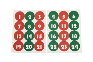 Detail of Christmas advent calendar tags with numbers 1 to 24 in red and green colors