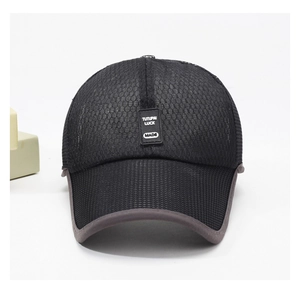 Detail of black mesh baseball cap with gray trim and rectangular rubber logo patch