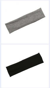 Detail view of grey and black knitted headbands showing striped cotton blend texture
