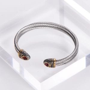 Stainless steel double twisted cable bracelet with red gemstone snake head detailing