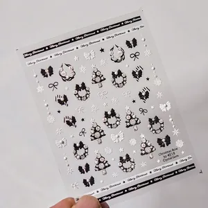 Autocollants ongles de Noël avec nœuds, cristaux et perles pour manucure festive