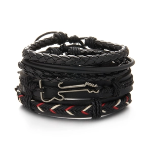 Detail of multi-layer black leather bracelet set featuring a silver guitar charm