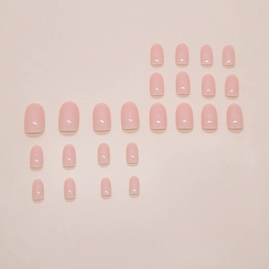 Glossy nude pink press-on nail kit with 24 pieces of various sizes on pink background