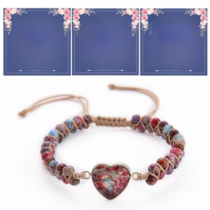 Detail of handmade heart-shaped natural stone bracelet with meaningful gift cards