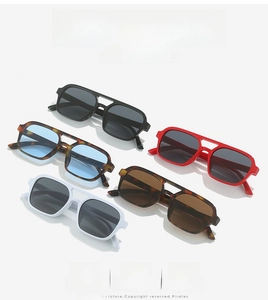Multiple stylish square double-bridge sunglasses shown in various colors on white background