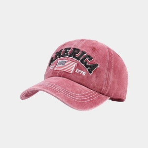 Close-up of vintage washed burgundy baseball cap with America flag embroidery details