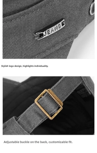 Detail of dark gray cotton flat cap featuring metal JEANS logo and adjustable buckle