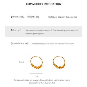Detailed view of large geometric circle earrings with dimensions 7.5cm by 7cm in copper