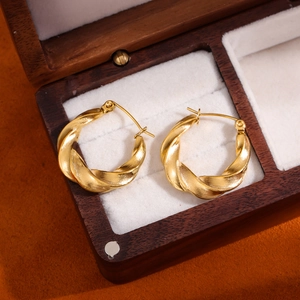 French minimalist 18k gold plated twisted hoop earrings on jewelry box