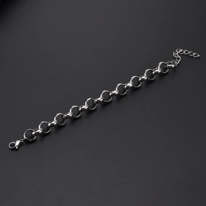 Detail of 12mm stainless steel pearl chain bracelet with lobster clasp on black background
