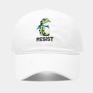 Detailed embroidery of a green frog with Resist text on a white cotton baseball cap