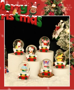 Close-up of Christmas Sanrio characters snow globes featuring Hello Kitty and friends