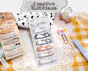 Detailed view of 180pcs cute cat index tabs on yellow checkered tablecloth decor