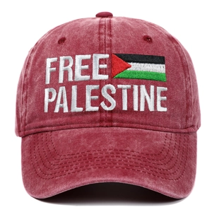 Close-up of Free Palestine embroidery and national flag on burgundy washed cotton cap