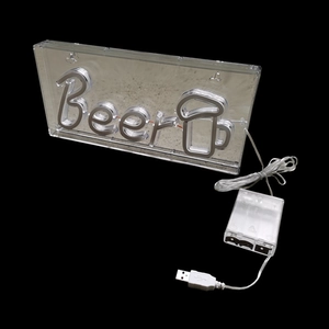 Detail of Beer neon sign on acrylic base with integrated USB cable and battery box