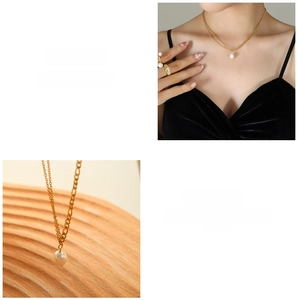 Detail of 18K gold double layer chain necklace with a baroque freshwater pearl pendant