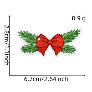 Detailed embroidery of a Christmas bow with green pine needles and size measurements
